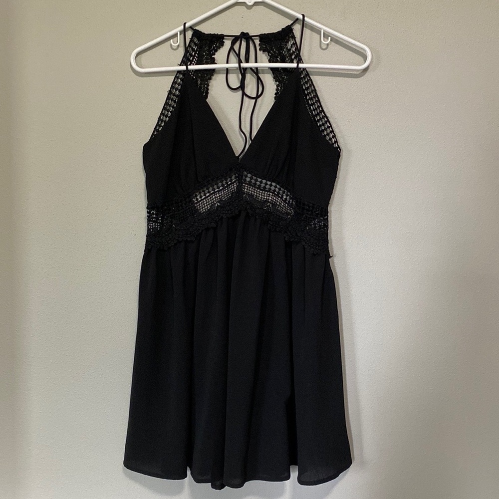 Open back, black babydoll dress.